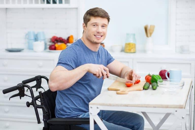 man cutting vegetables